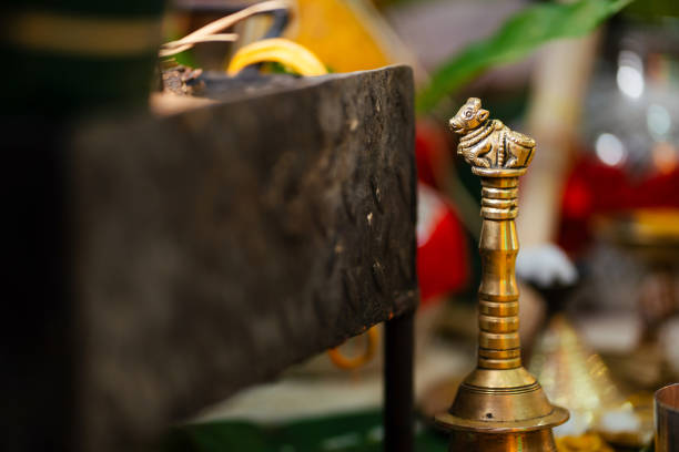 istock Brass Nandi hand held Pooja bell close up 1418653513