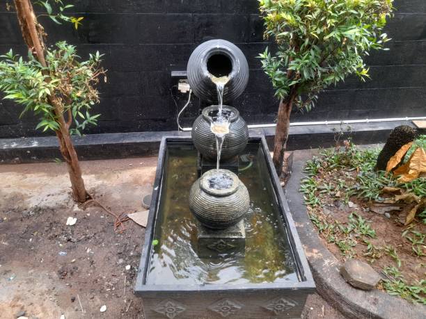 istock fountain design from a jar in the yard 1418659783