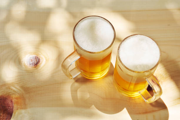 istock refreshing cold beer glasses on wooden background 1418662367