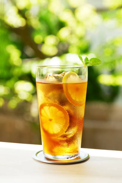 istock refreshing iced tea glasses on wooden background 1418662387