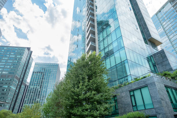 istock Modern Apartment and Office Towers on Tree-Lined Downtown Street 1418662447