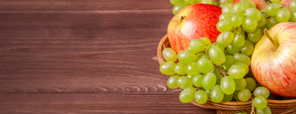Banner with ripe grapes and apples.