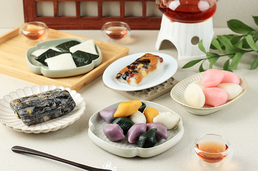 Various Rice Cake, Korean Traditional Food. Songpyeon, Baramtteok, Keguremtteok, Jeolpyeon, Modemtteok, Served with Tea for Chuseok