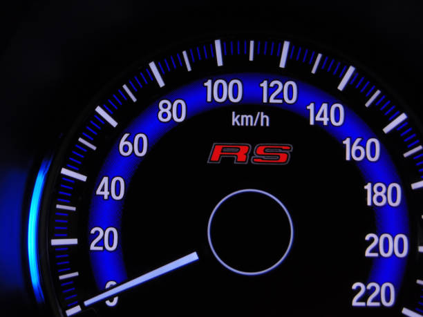 Close up blue speedometer manual in black background