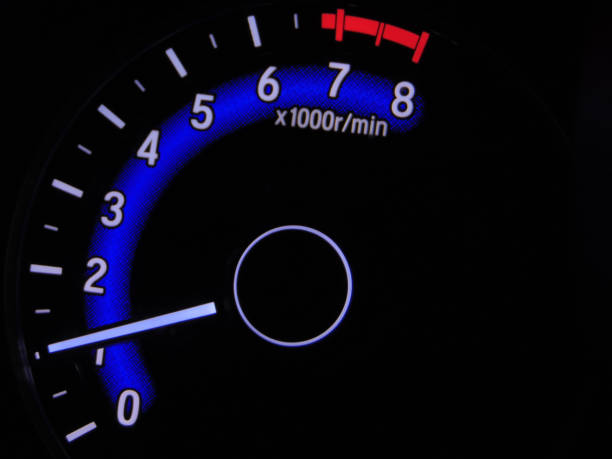 istock Close up blue speedometer manual in black background 1418678121