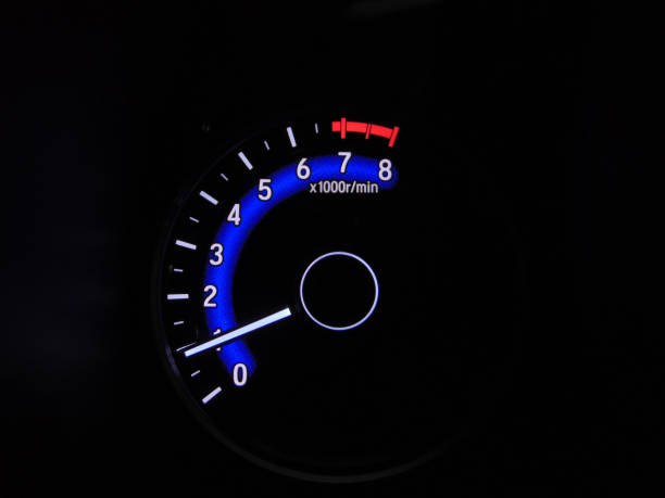istock Close up blue speedometer manual in black background 1418678126