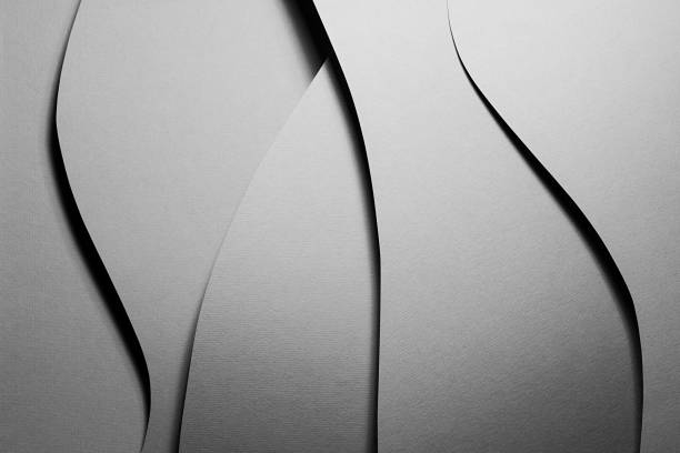 istock Carbon grey abstract geometric background with soar vertical curved waves pattern in hard light with black shadows as monochrome stylish backdrop in elegant simple modern minimal style, top view. 1418687710
