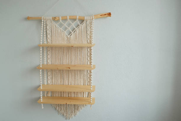 istock Macrame wooden shelf hanging on the wall 1418689887