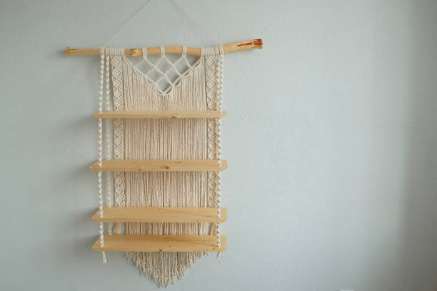 istock Macrame wooden shelf hanging on the wall 1418689888