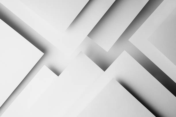 istock White abstract geometric background with white paper sheets soar as abstract spaces in glow with triangles, corners, stripes, perspective and shadows in simple strict modern style for business. 1418690439