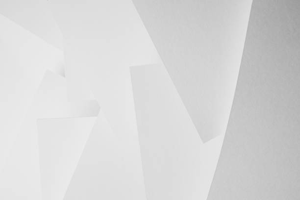 istock White abstract geometric background with soft light paper sheets fly as spaces in chaotic pattern with glow and gradient in simple monochrome modern style for business. 1418690558
