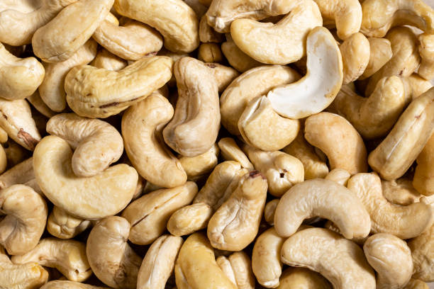 istock raw cashew nut on black background 1418693216