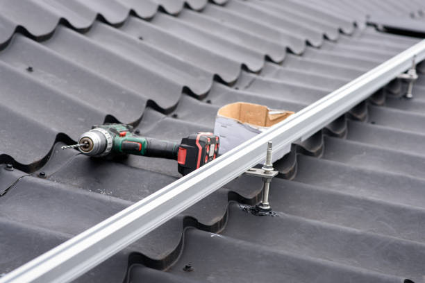 istock Brackets solar panel mounting system. Process of mounting solar power system on the roof. Turnkey solar power system, service works. Green energy. Rooftop solar power system 1418695926