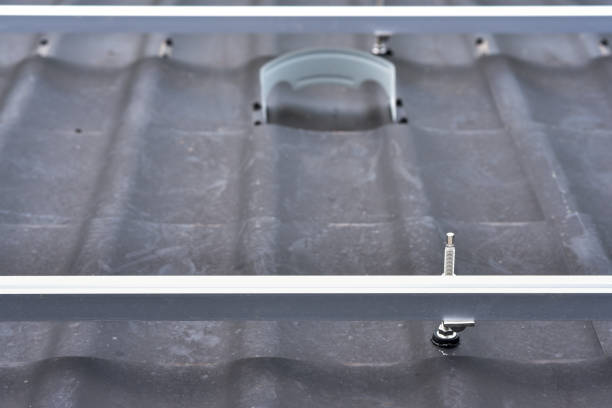 istock Brackets solar panel mounting system. Process of mounting solar power system on the roof. Turnkey solar power system, service works. Green energy. Rooftop solar power system 1418695935