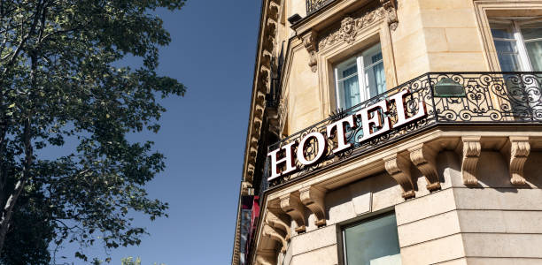 Hotel sign on building facade in city, business travel and tourism stock photo