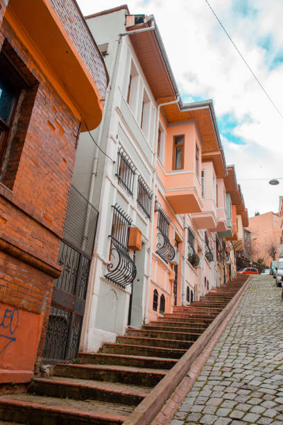 street with stairs with colorful houses in istanbul's balat district - balat stok fotoğraflar ve resimler