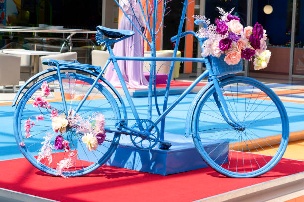 istock Decorative vintage blue bicycle with flowers 1418714917