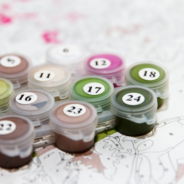Multi-color bright palette of acrylic paints for drawing a picture by numbers. Homemade hobby stock photo