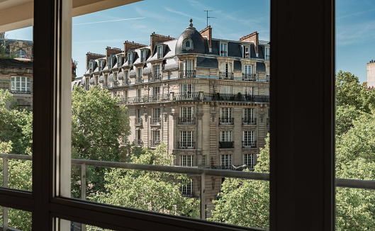 Typical Paris architecture. View from the office building window on a beautiful, old,  19th-century, historic tenement house (townhouse).