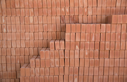 Large wooden checkered pattern background structure of multi colored cubes, front view horizontal composition