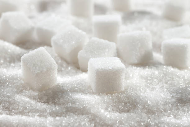 istock White granulated sugar and refined sugar cubes close-up 1418741607