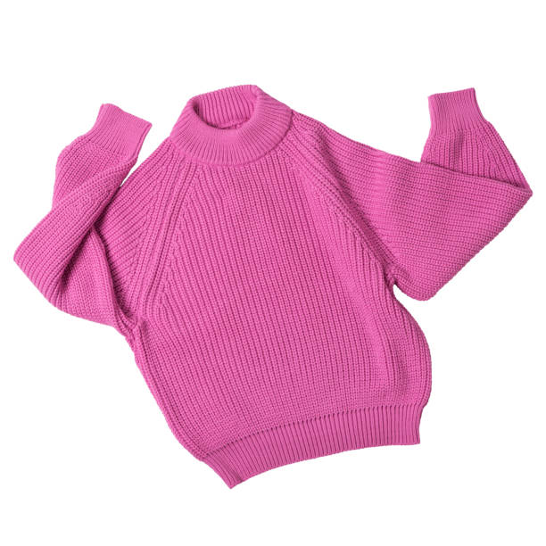 istock Pink knitted wool sweater, as if dancing with arms raised, on a white background 1418745208