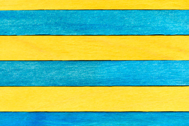 istock Blue and yellow painted wooden boards. 1418749398