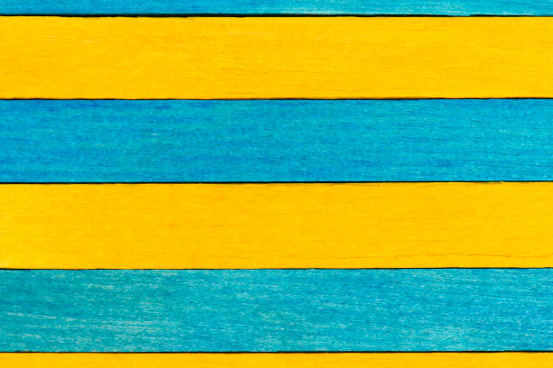 istock Blue and yellow painted wooden planks. 1418749894