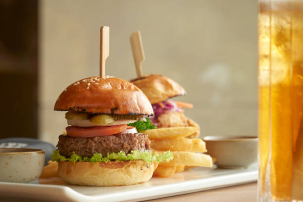 istock Juicy homemade beef burger with  fresh vegetable on white flat plate 1418751298