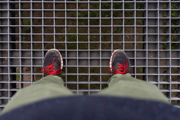 Men Walking on the Steel Net
