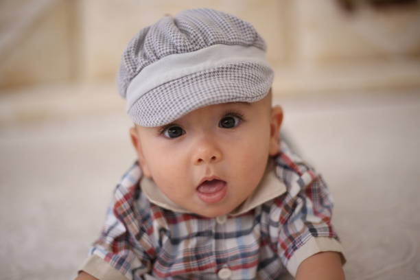 istock Portrait of a boy lying on the carpet. 1418761780