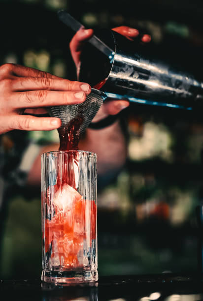 istock bartender making cocktail Bloody Mary in a nightclub bar 1418765743