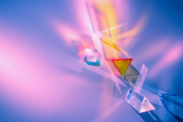 Glass prisms and cubes with color spectrum rays. Abstract background with reflection and refraction of light. Shadow and rays of natural light effects.