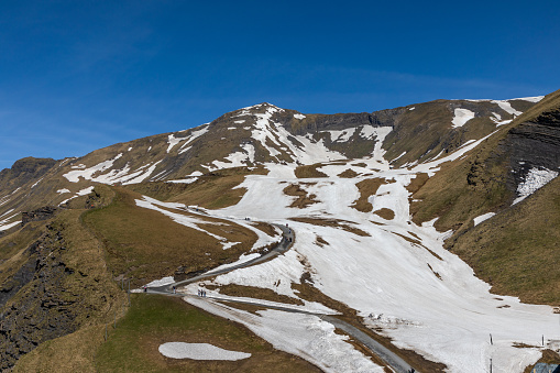 Melting winter snow during spring season in the Swiss Alps at the First Mountain near the town of Grinderwald