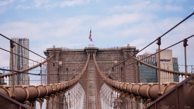 Perspective View of Brooklyn Bridge Towers with American National Flag on Top