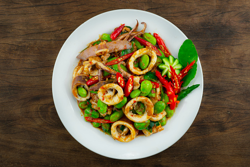 Stir Fried Squids with Stink Bean and Shrimp Paste Spicy dish Thaifood Style decoration carving vegetables