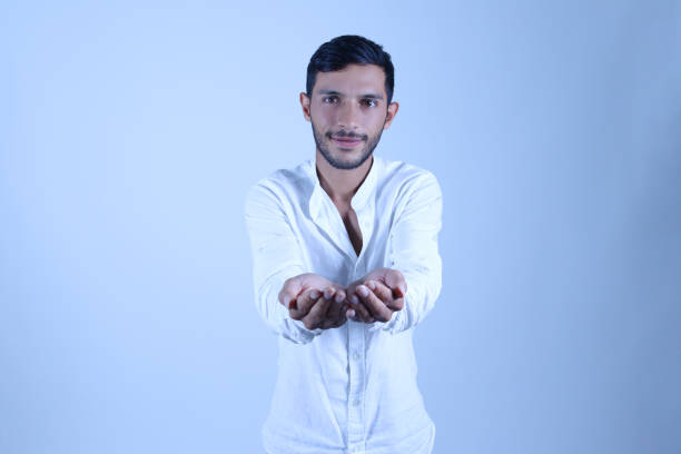young man extending his hands to the camera