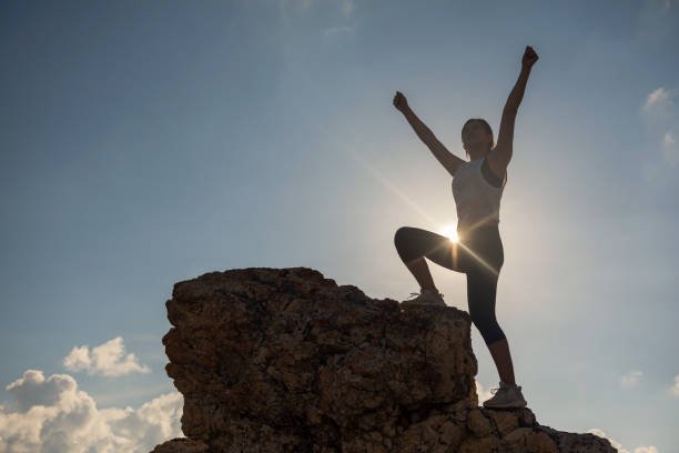 istock Victory hand gesture at moutain peak at sunset 1418797394