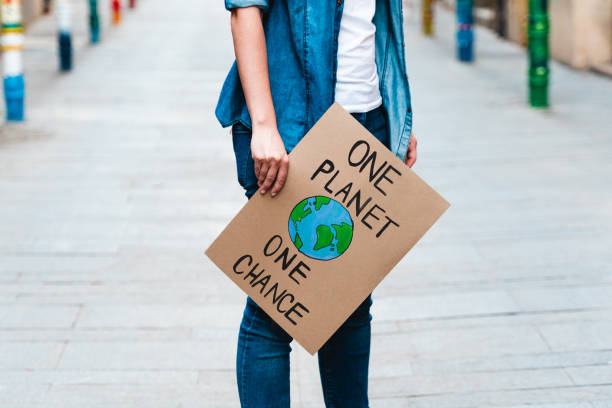 istock Activist holding banner - Ecology concept 1418800018