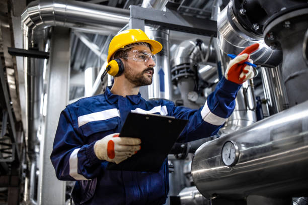 istock Working in oil refinery plant. 1418801518