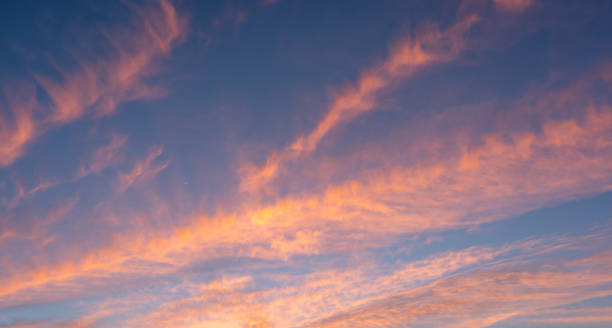 istock Colorful Sunset Skies with Moon on the Side 1418801872