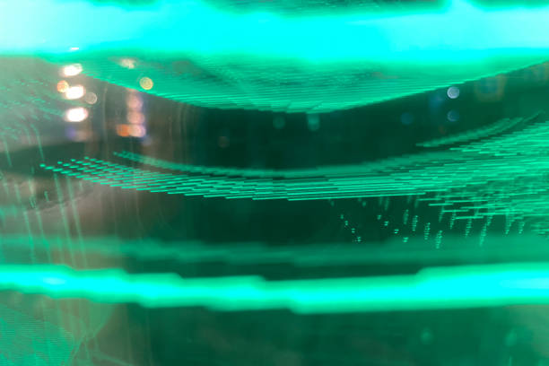 istock Fluted texture. Neon green light background. Metal surface with a groove. Fluorescent gradient of green color reflecting the glow on the parallel lines of the pattern, dark black abstract overlay. 1418804598