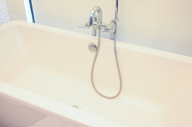 istock hydrant shower with bathtub in bathroom 1418804941