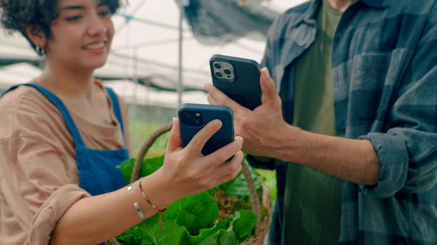 istock Asian Man Buying Vegetables from Hydroponic Farm and Making Payment. 1418808113
