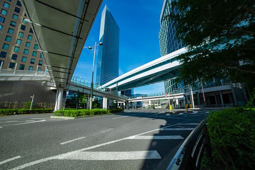 A empty city crossing at the business town in Tokyo. High quality photo. Minato district Shiodome Tokyo Japan - 07.25.2022 : It is a center of the city in tokyo.