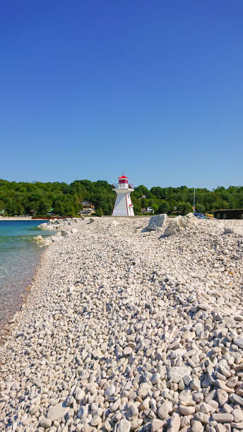 Lion's Head Harbour Lighthouse at Lion's Head Beach Harbour in Provincial Park Ontario Canada. Isthmus Bay lake Huron. Lion's Head Point. stock photo