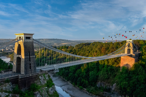 The Clifton Suspension Bridge with ballons from the International Balloon Fiesta in the distance