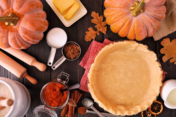istock Autumn baking table scene with pumpkin pie ingredients 1418816964