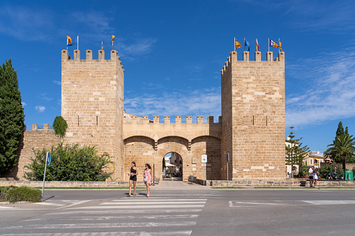Alcudia, Spain - Aug 21, 2022: Gate of Mallorca (also know as St Sebastian gate) Alcudia Old Town, Mallorca, Spain.