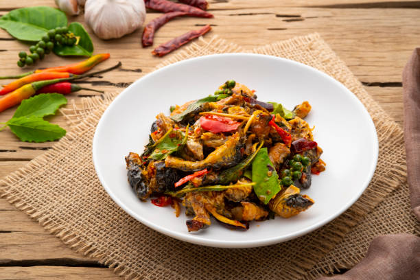 istock Spicy Stir Fried Frog meat with chilli paste and basil leave 1418818338